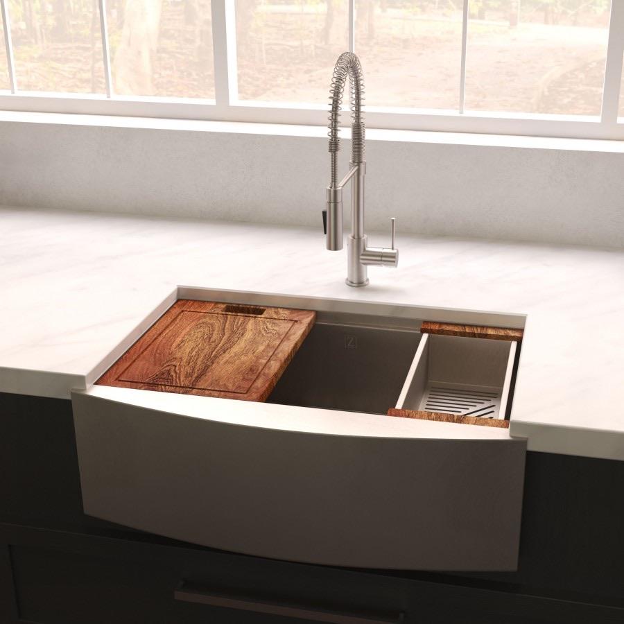 Single-bowl stainless steel farmhouse sink with tall faucet and wood cutting board