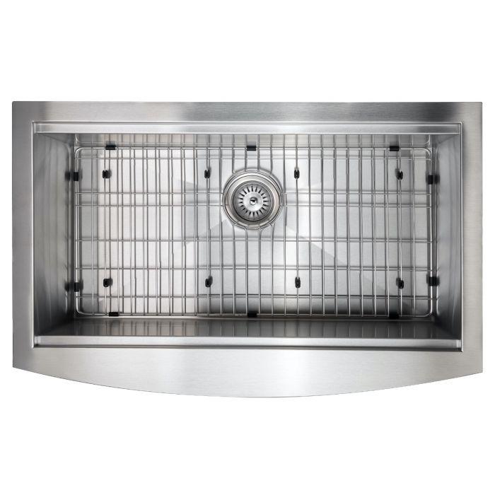 Single-bowl stainless sink interior with bottom grid and round drain strainer