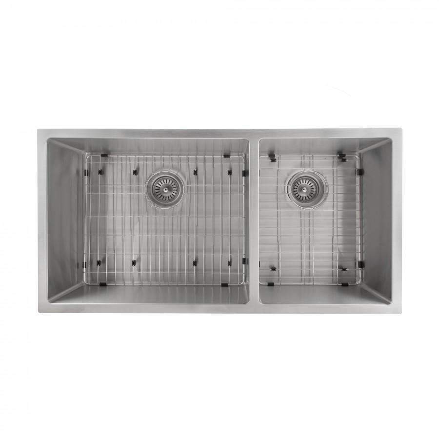 Undermount double-bowl sink interior showing grids and drain openings