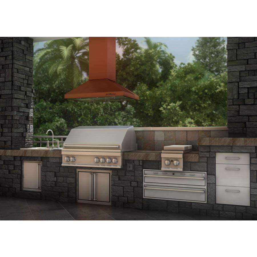 Copper island range hood with chimney over outdoor stone kitchen counter