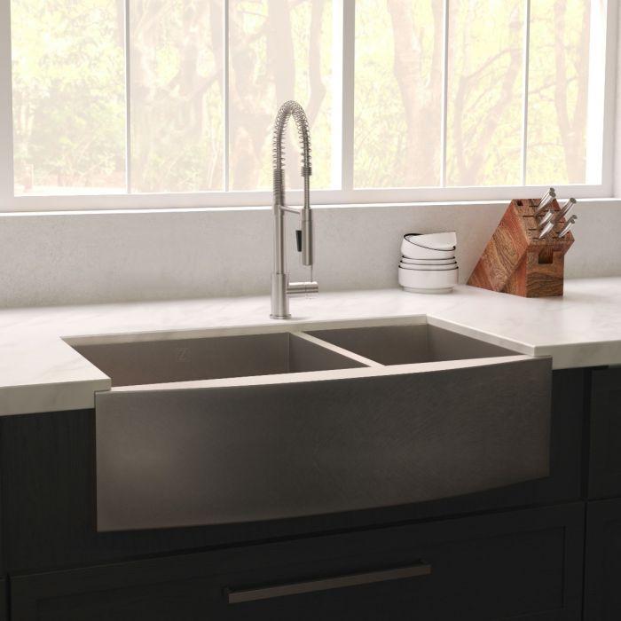 Stainless steel farmhouse apron sink with double bowls and matching faucet