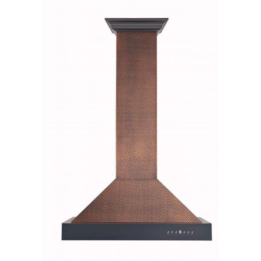 Copper wall range hood with hammered textured chimney and dark top trim
