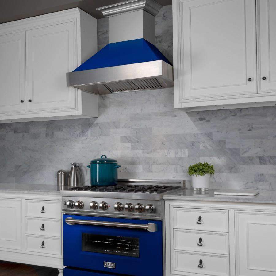 Ducted wall-mount range hood featuring blue canopy and stainless chimney above stove