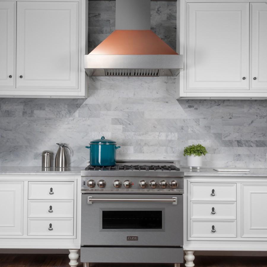 Stainless steel ducted range hood with copper hood insert and vent fan grille