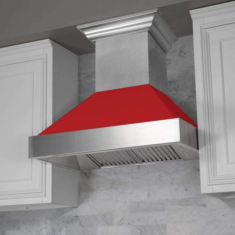 Ducted wall range hood with red matte baffle and stainless chimney, close-up angle