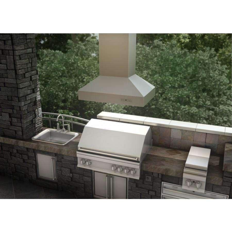 Outdoor island mount range hood with stainless chimney and wide canopy over cooktop