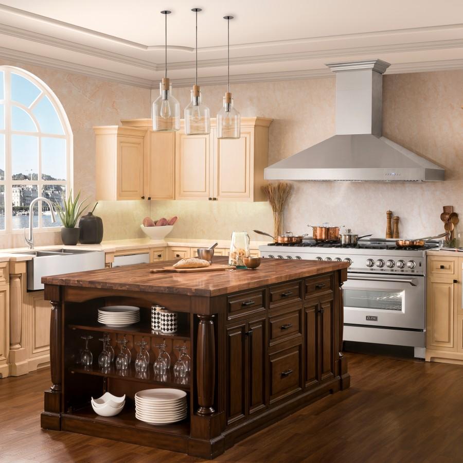 Stainless steel ducted wall mount range hood over the stove in a classic kitchen