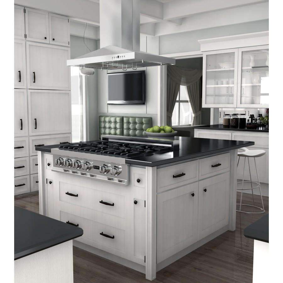 Stainless steel island range hood above black cooktop on white cabinetry