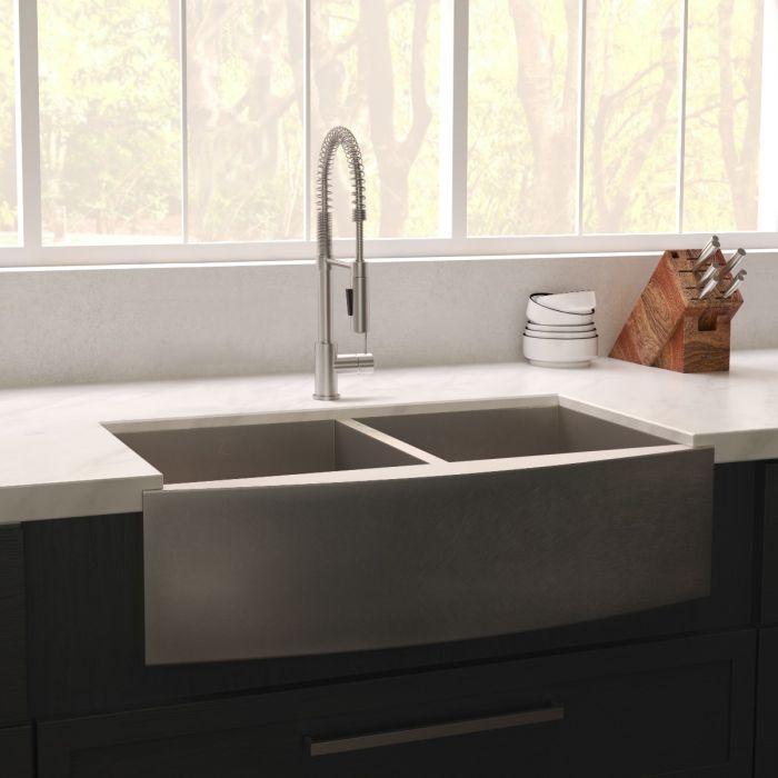 Stainless steel double-bowl kitchen sink with apron-front design and two basins