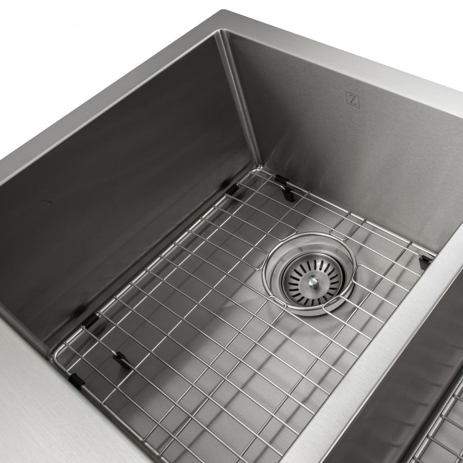 Stainless steel double-bowl apron sink with fitted metal bottom grid and drain