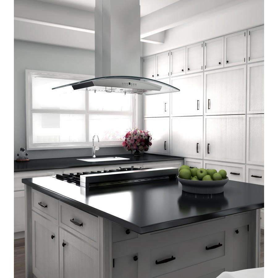 Island range hood above a cooktop with stainless chimney and curved glass canopy