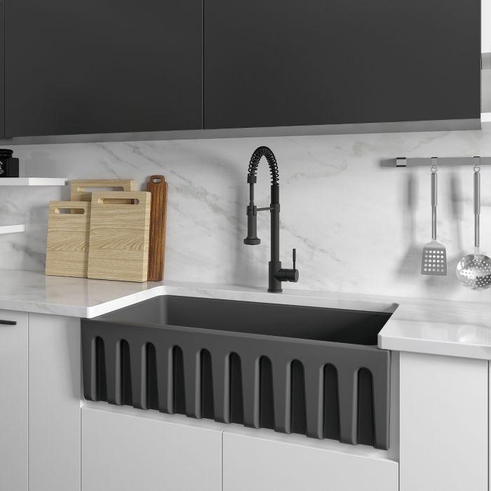 Charcoal apron front single-bowl sink with mounted faucet in kitchen