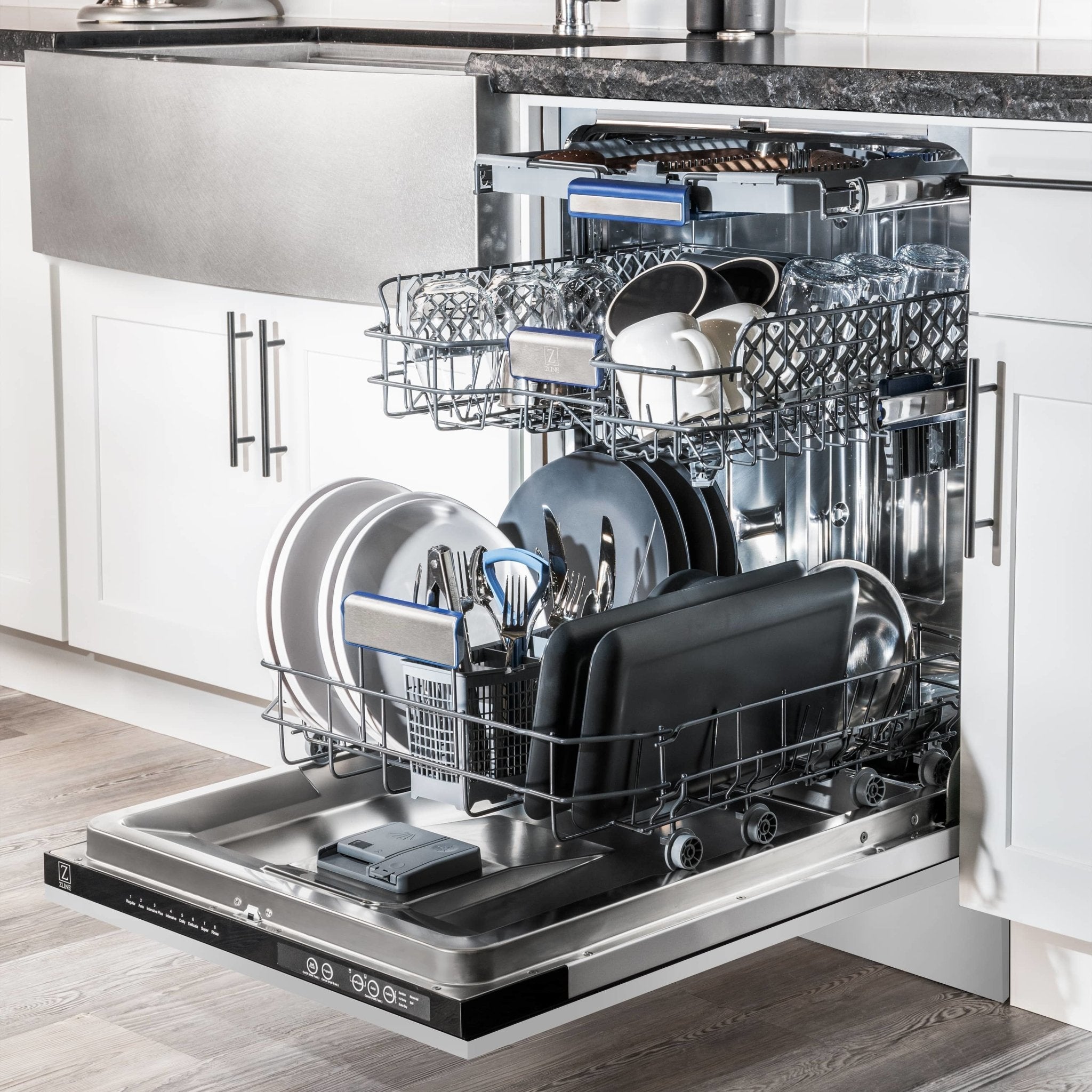 Stainless steel built-in dishwasher with open door and loaded dish racks