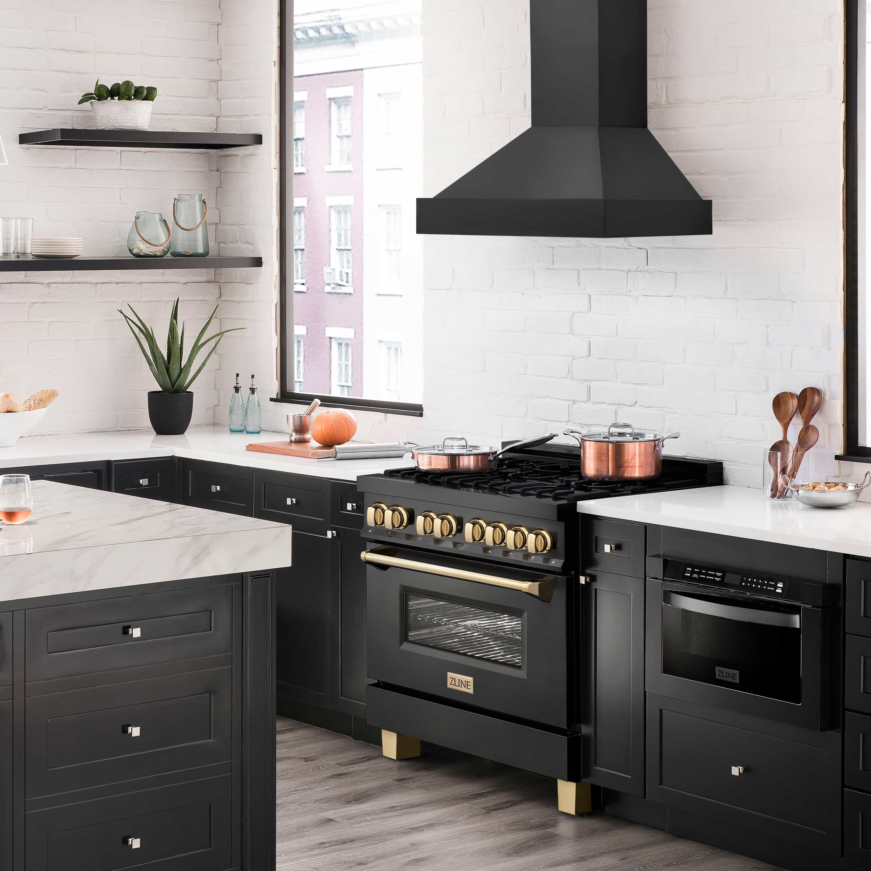Black gas range with grates, oven window, and range hood above