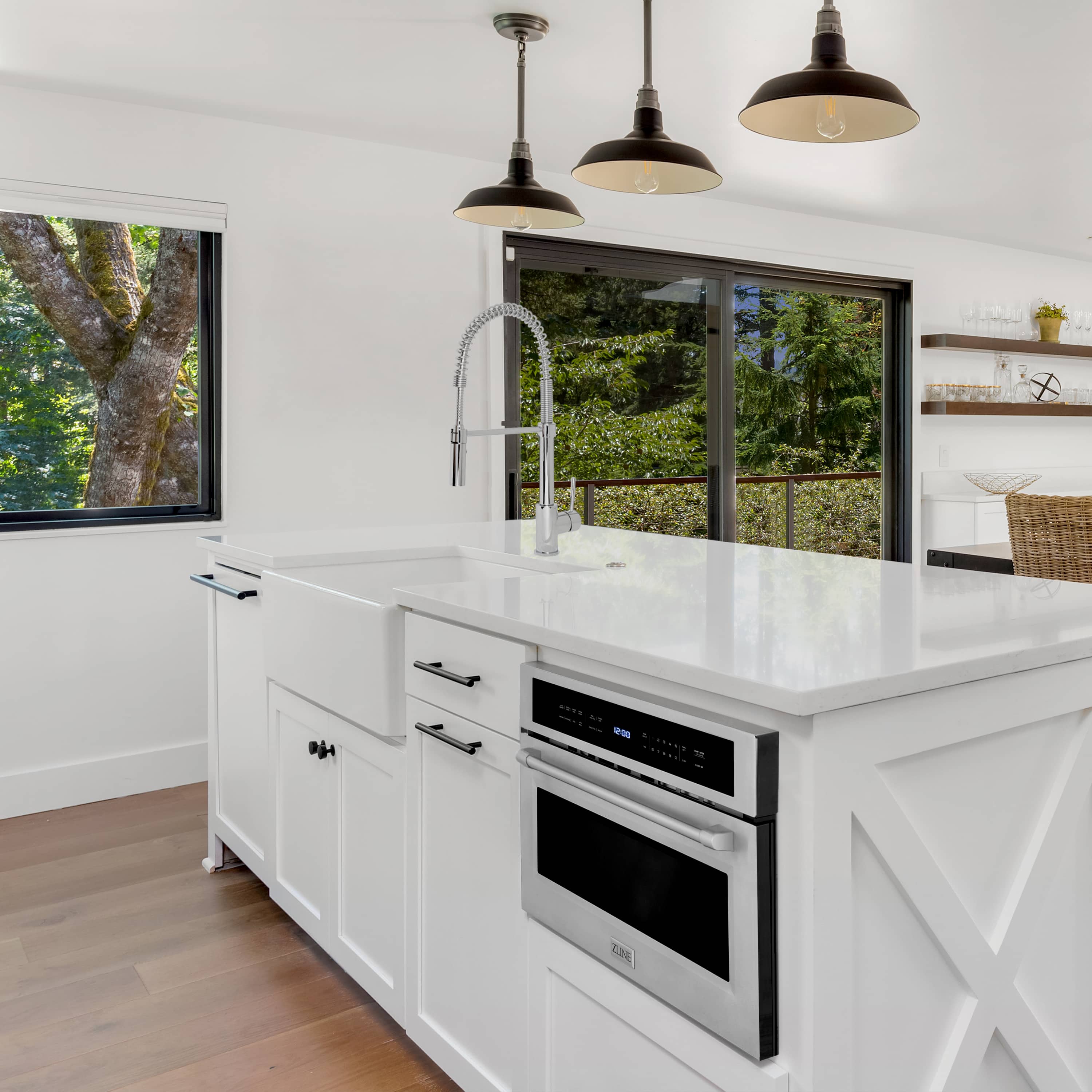 White built-in double oven and matching microwave drawer in kitchen cabinetry