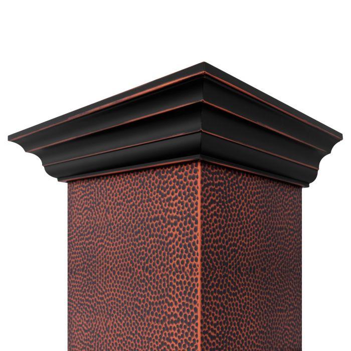 Hand-hammered copper chimney corner detail with dark top trim