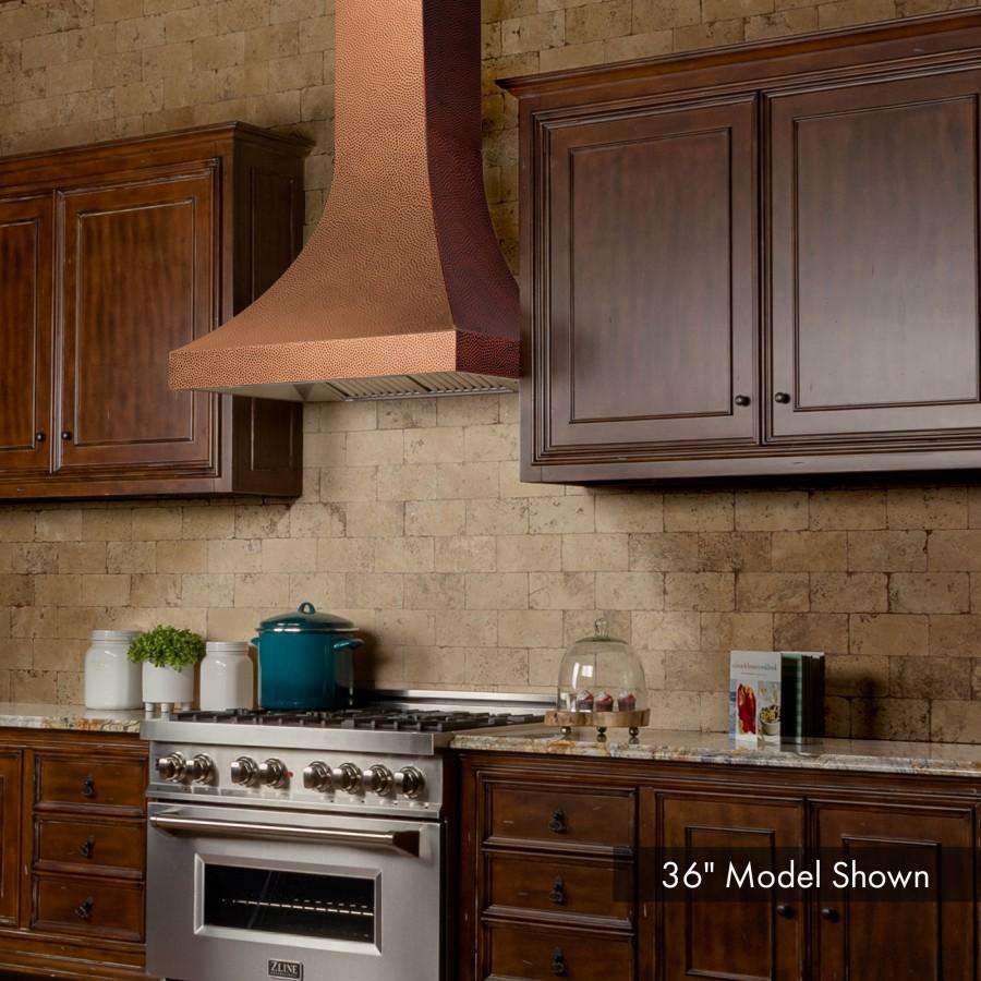 Copper hammered-finish wall range hood chimney with vented underside and control panel