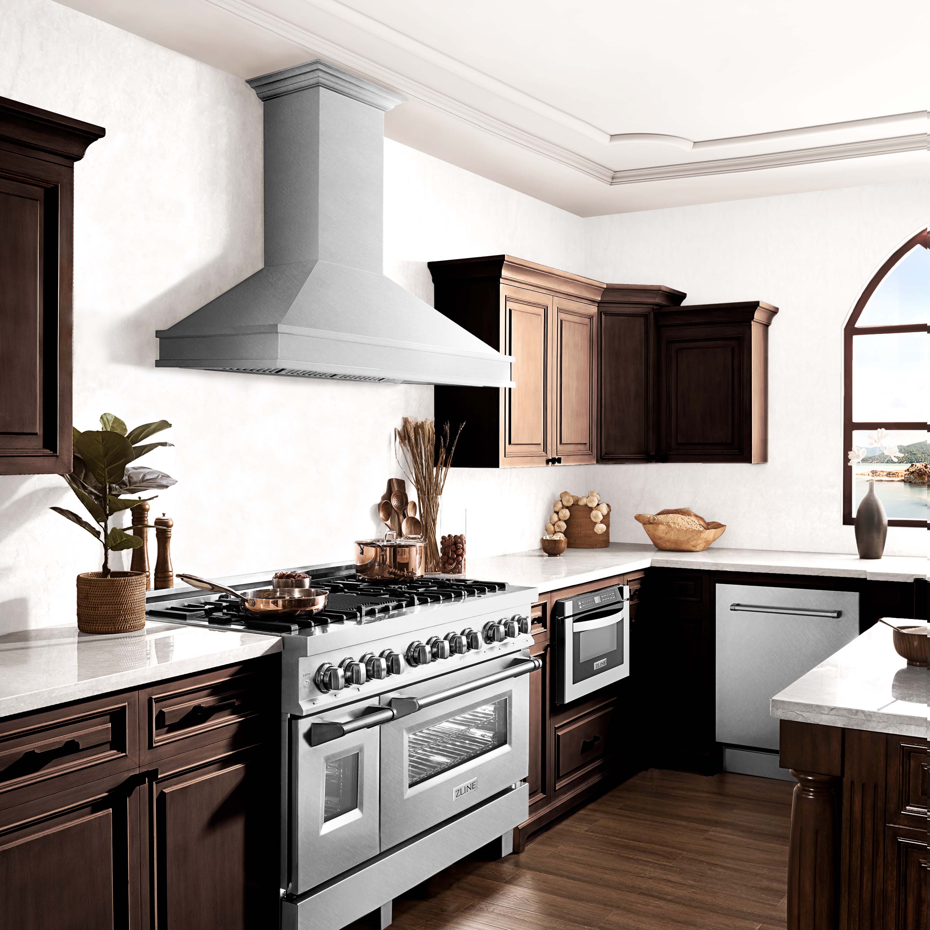 Wall-mount satin stainless steel chimney range hood above a cooktop