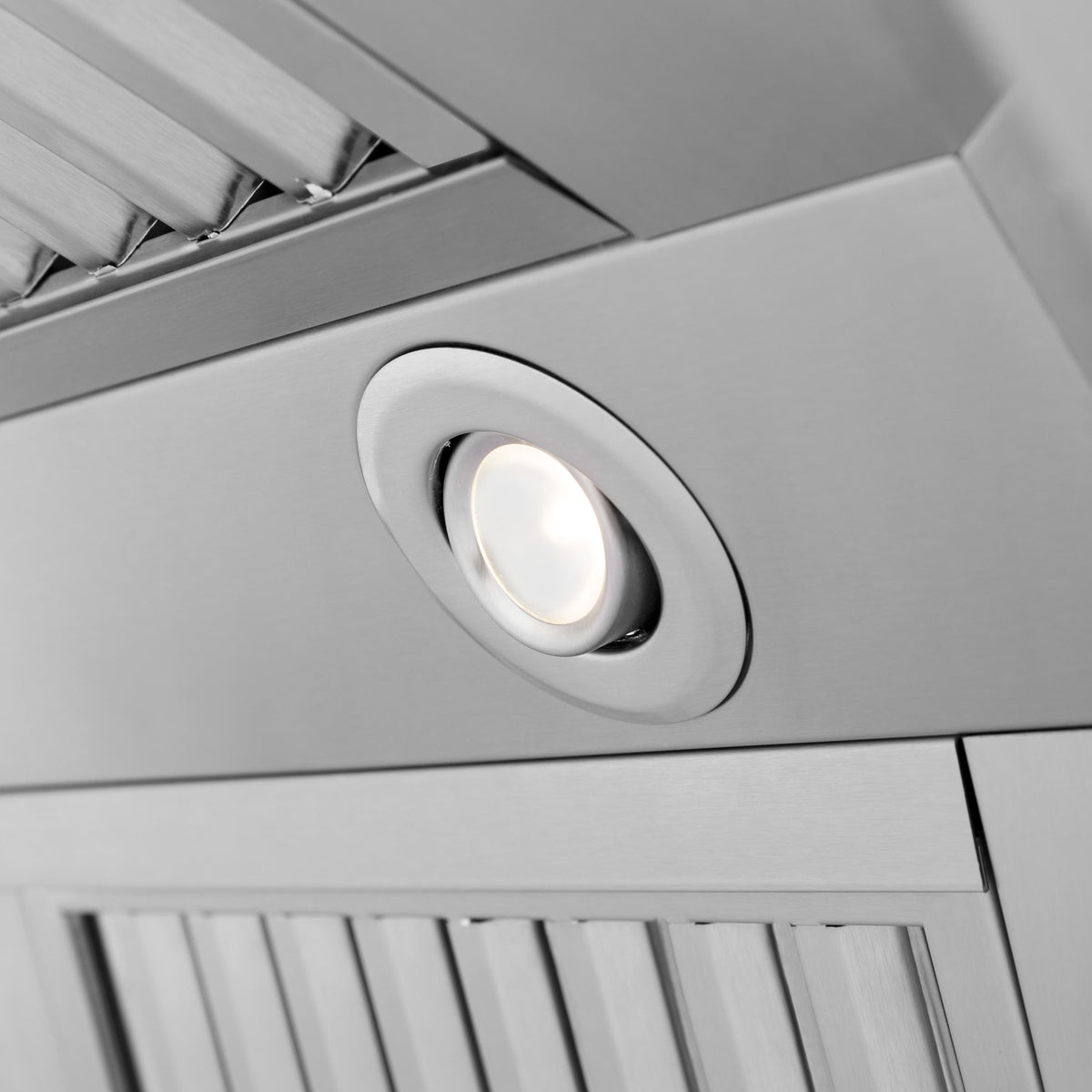Stainless steel range hood recessed spotlight in a round trim bezel