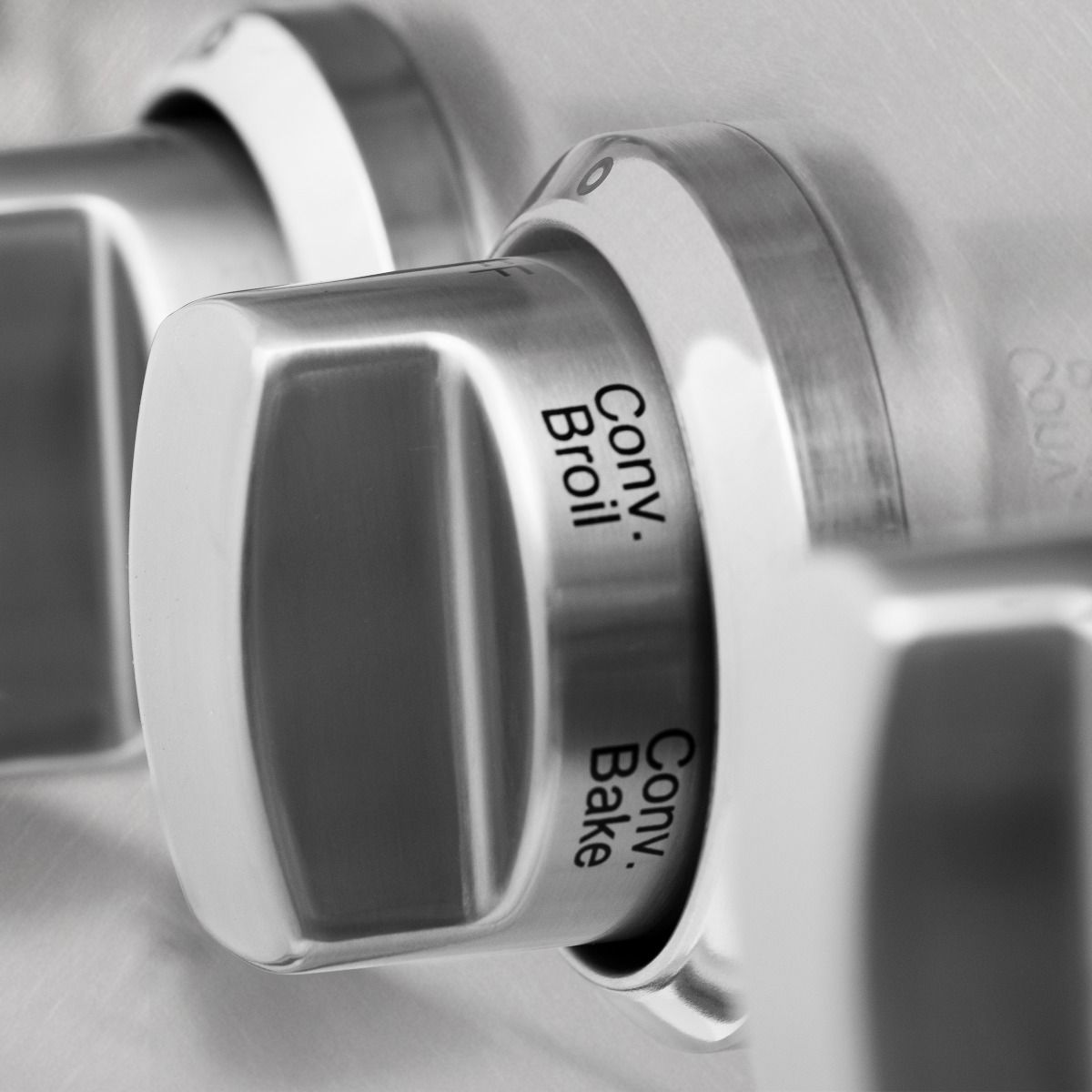 Stainless range control knob labeled Cook, Broil, Bake, and Oven
