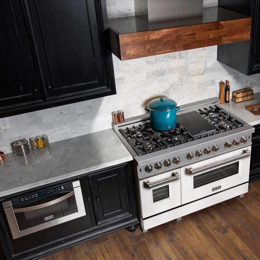 Stainless steel dual fuel range with black burner grates and white matte oven doors