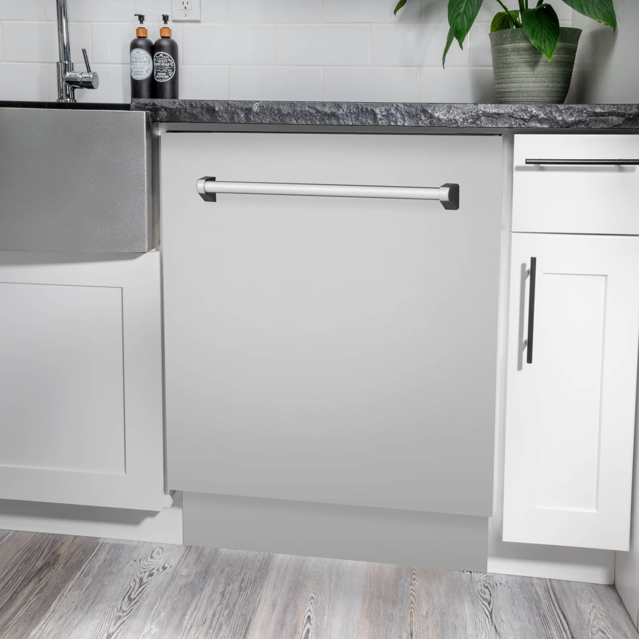 Built-in dishwasher cabinet door in white with pull handle under counter