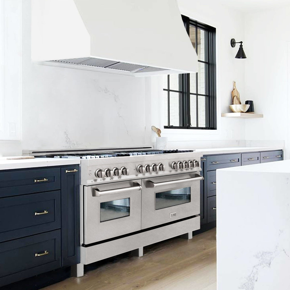 Stainless steel dual fuel range with two ovens and control panel, front corner view