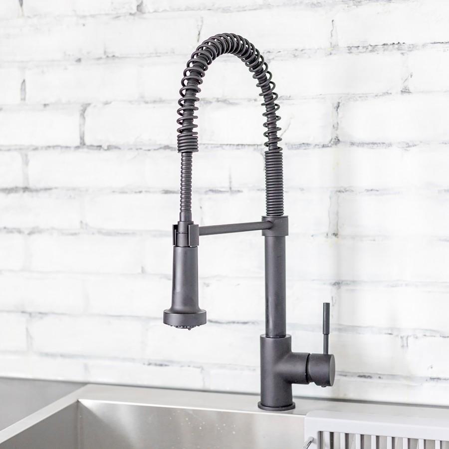 Matte black kitchen faucet with tall arched spout, coiled hoses, and two handle valves