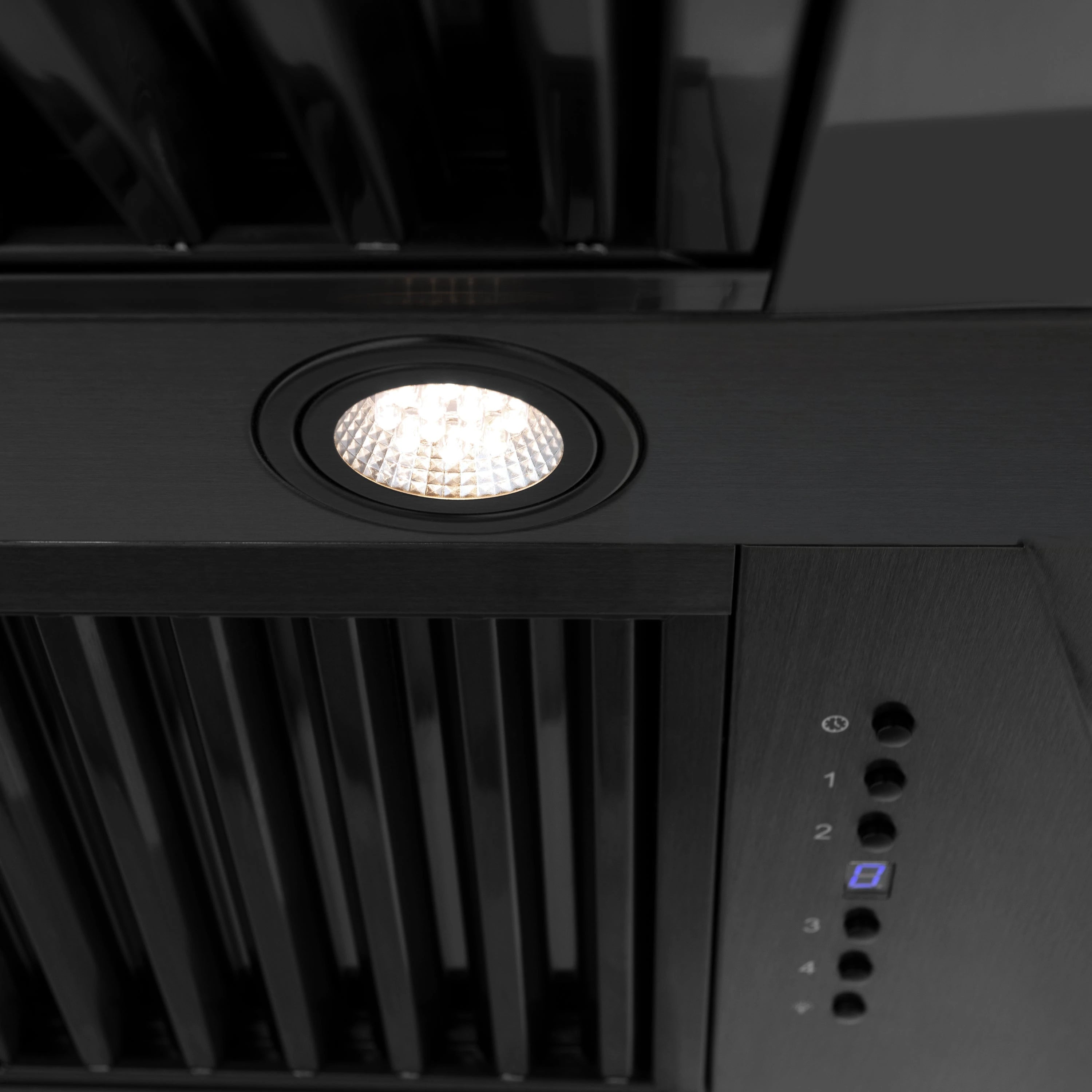 Black range hood control area with recessed LED light over vented grille