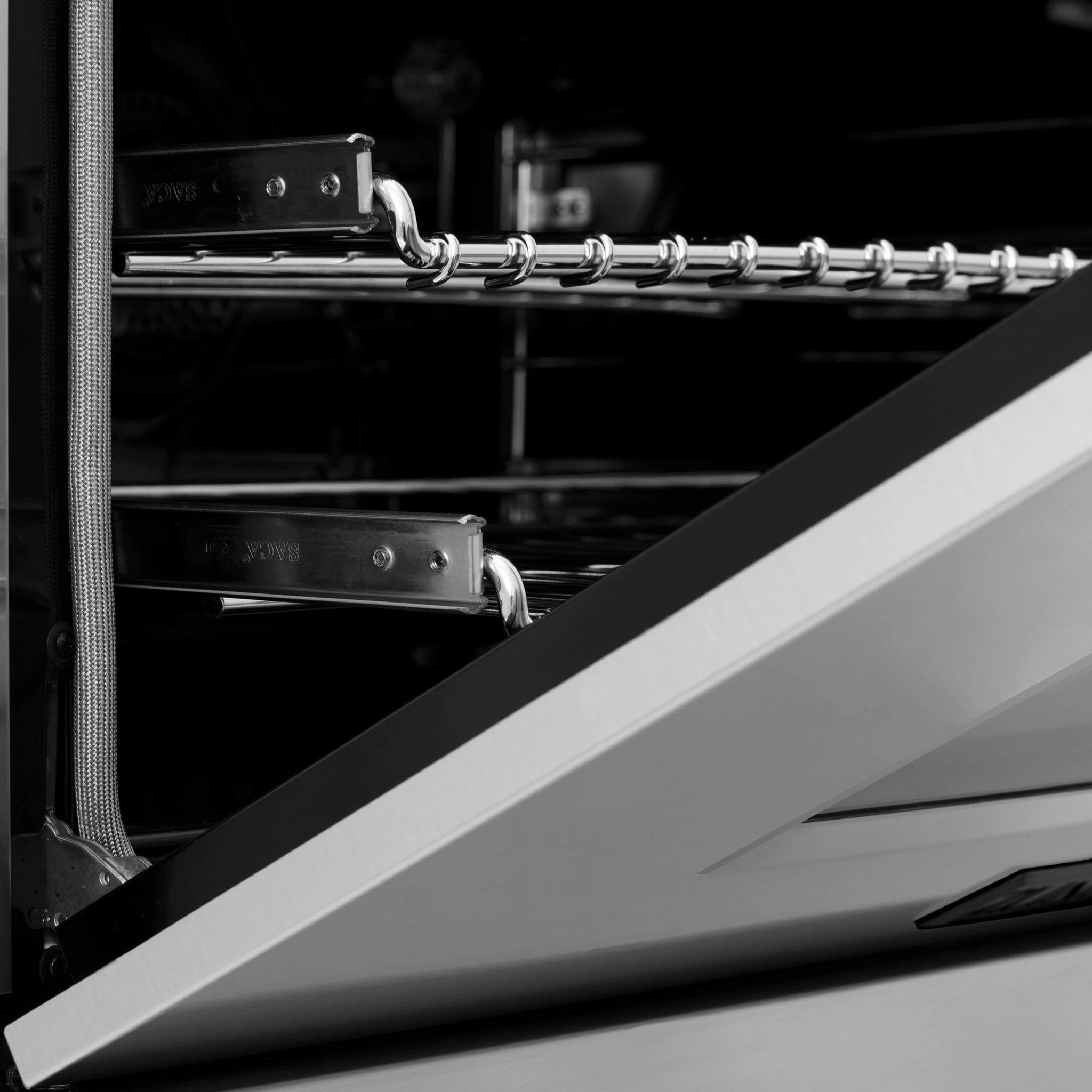 Dual fuel range oven interior with wire racks and rail supports
