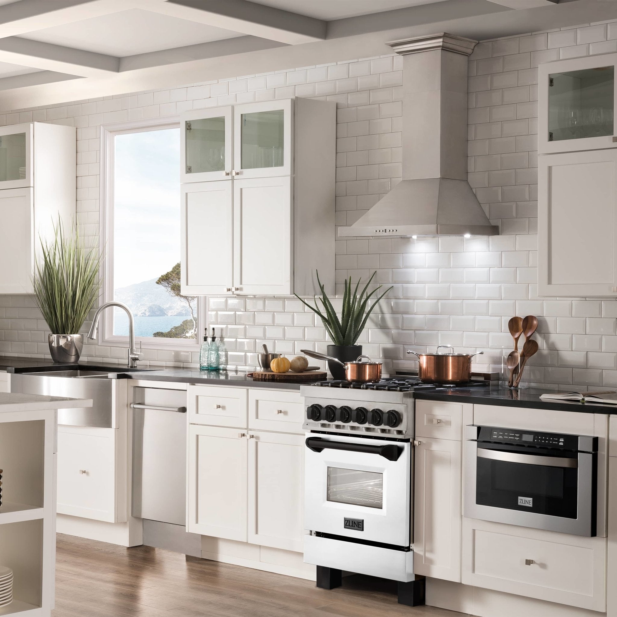 Stainless and white dual fuel range with black grates, oven door, and control panel