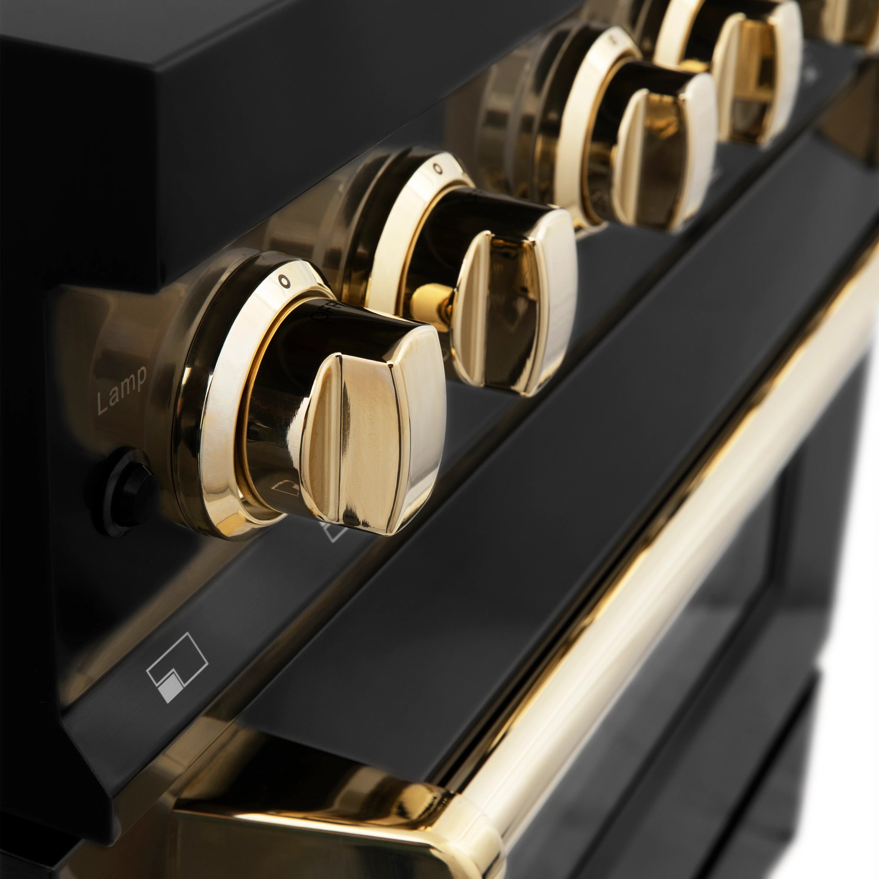 Black oven control knobs with gold-tone accents and indicator dials