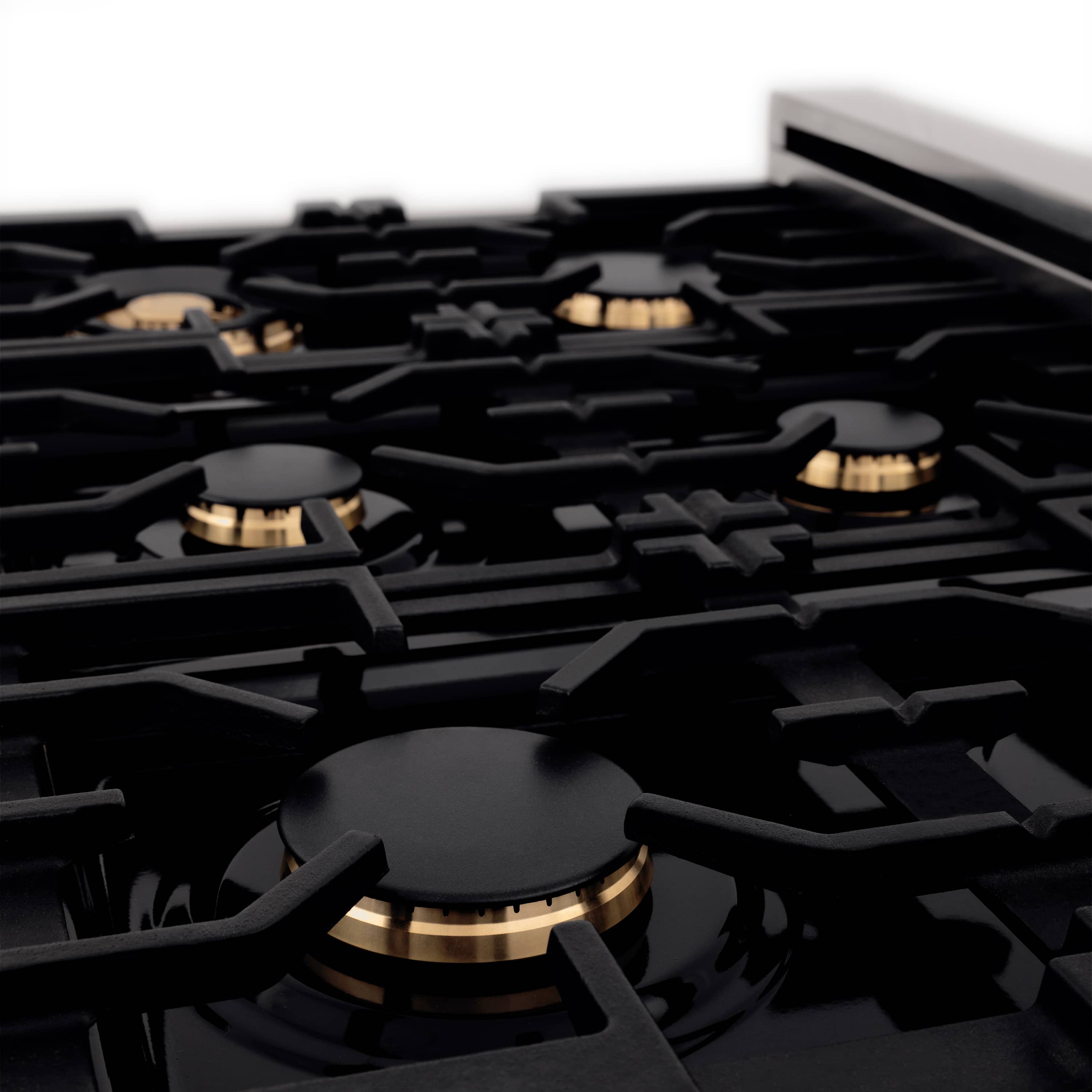 ZLINE 36-inch range burner grate and cast burner heads with gold accents