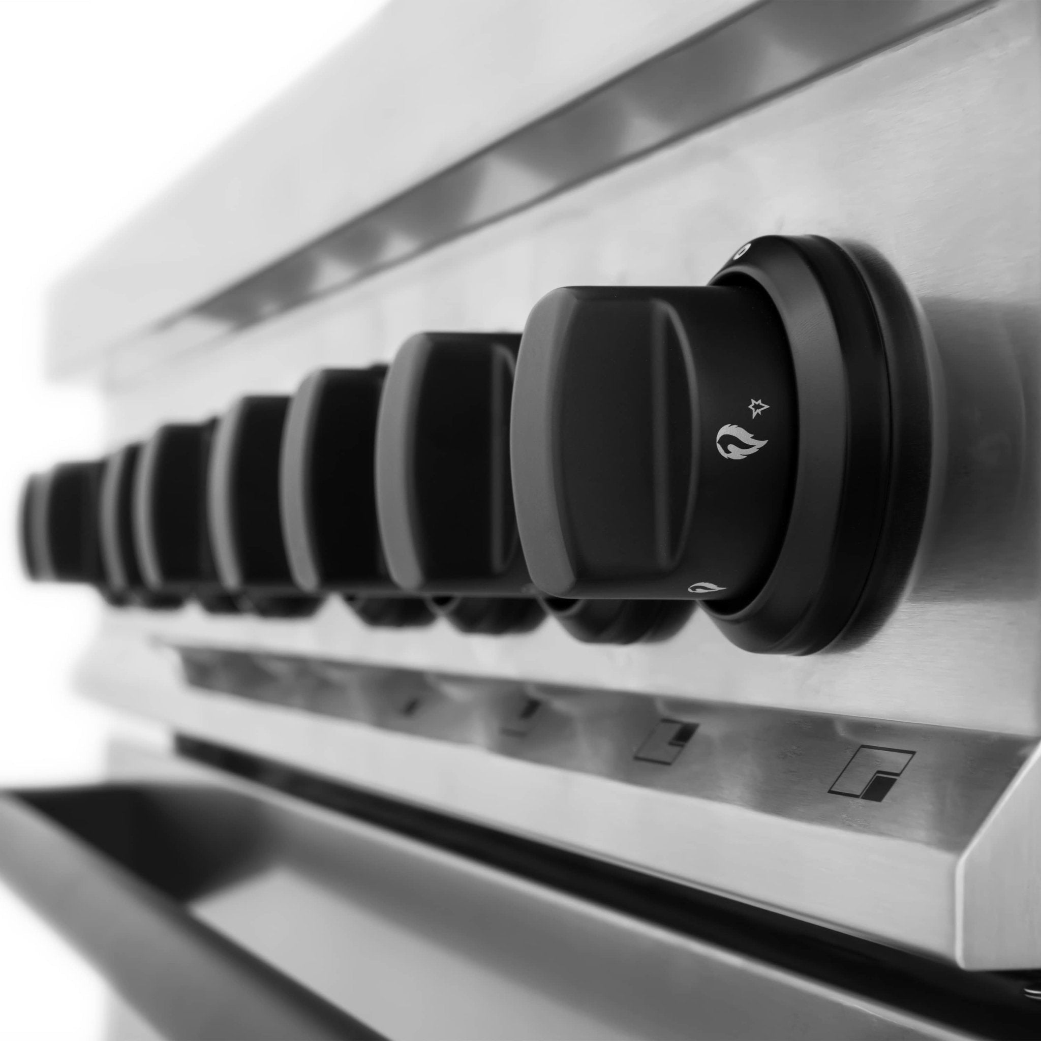 Stainless steel gas range control knob with heat icon and surrounding panel