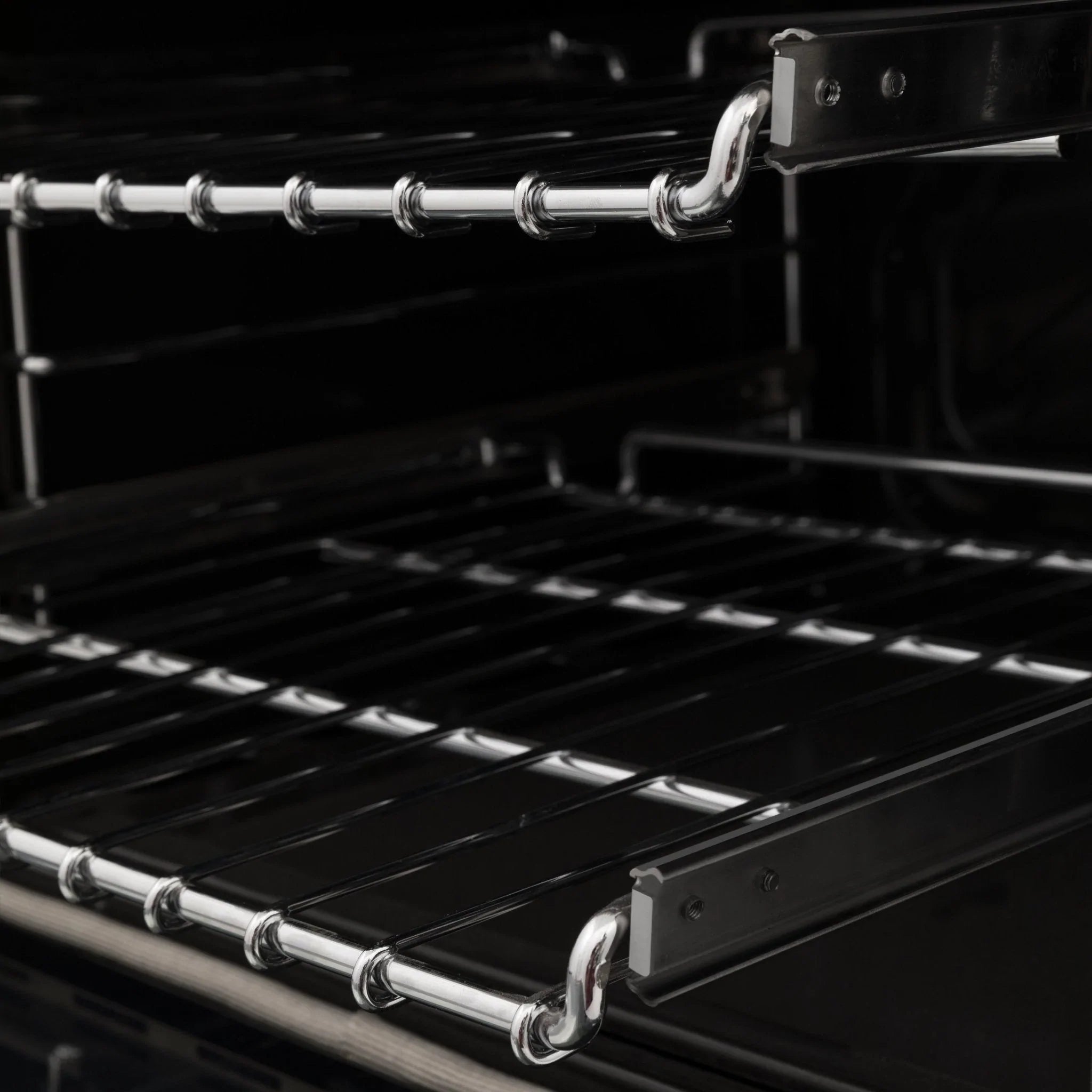 Black dual fuel range cooktop with cast grates and chrome burner rings