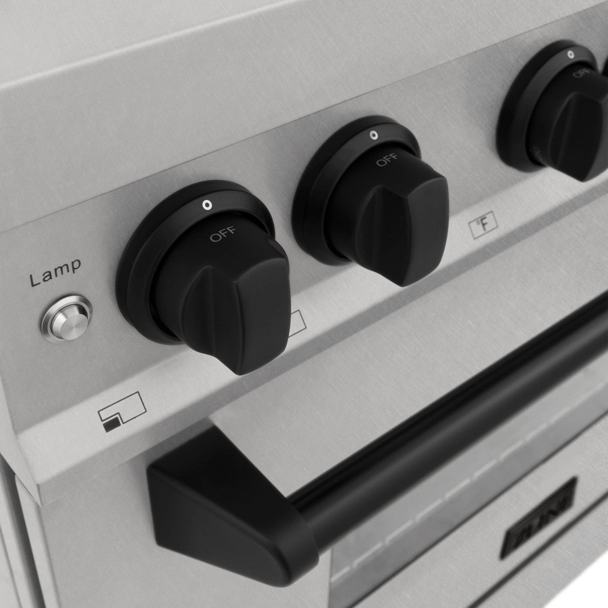 Dual fuel range front controls with three black knobs, labeled settings, and oven handle