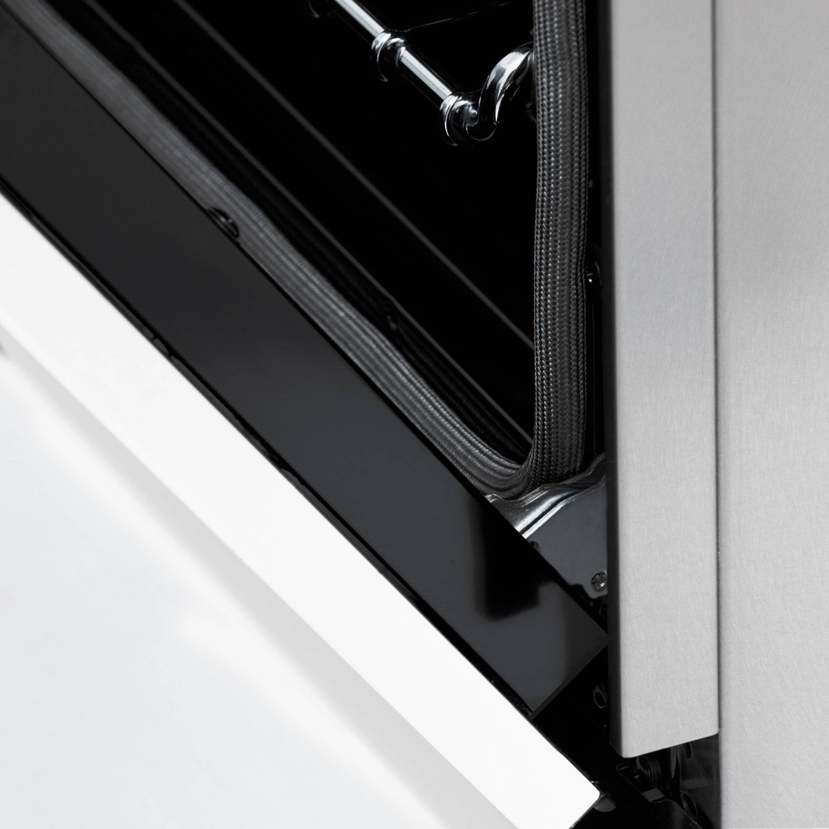 Dual-fuel oven door seal and inner frame detail with textured insulation