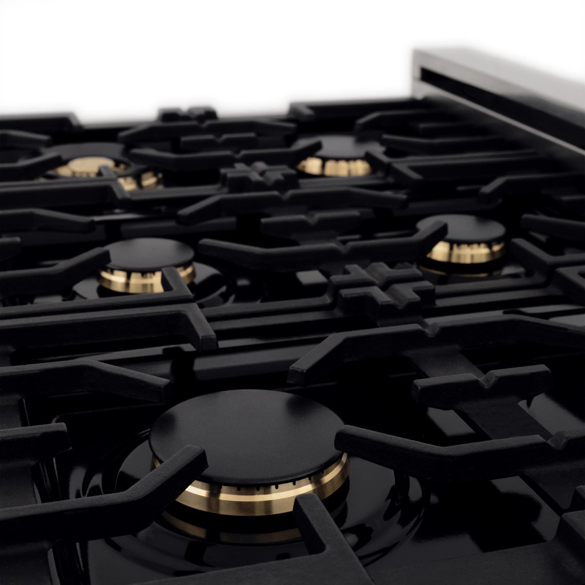 Dual fuel range cooktop with black grates and bronze burner bases