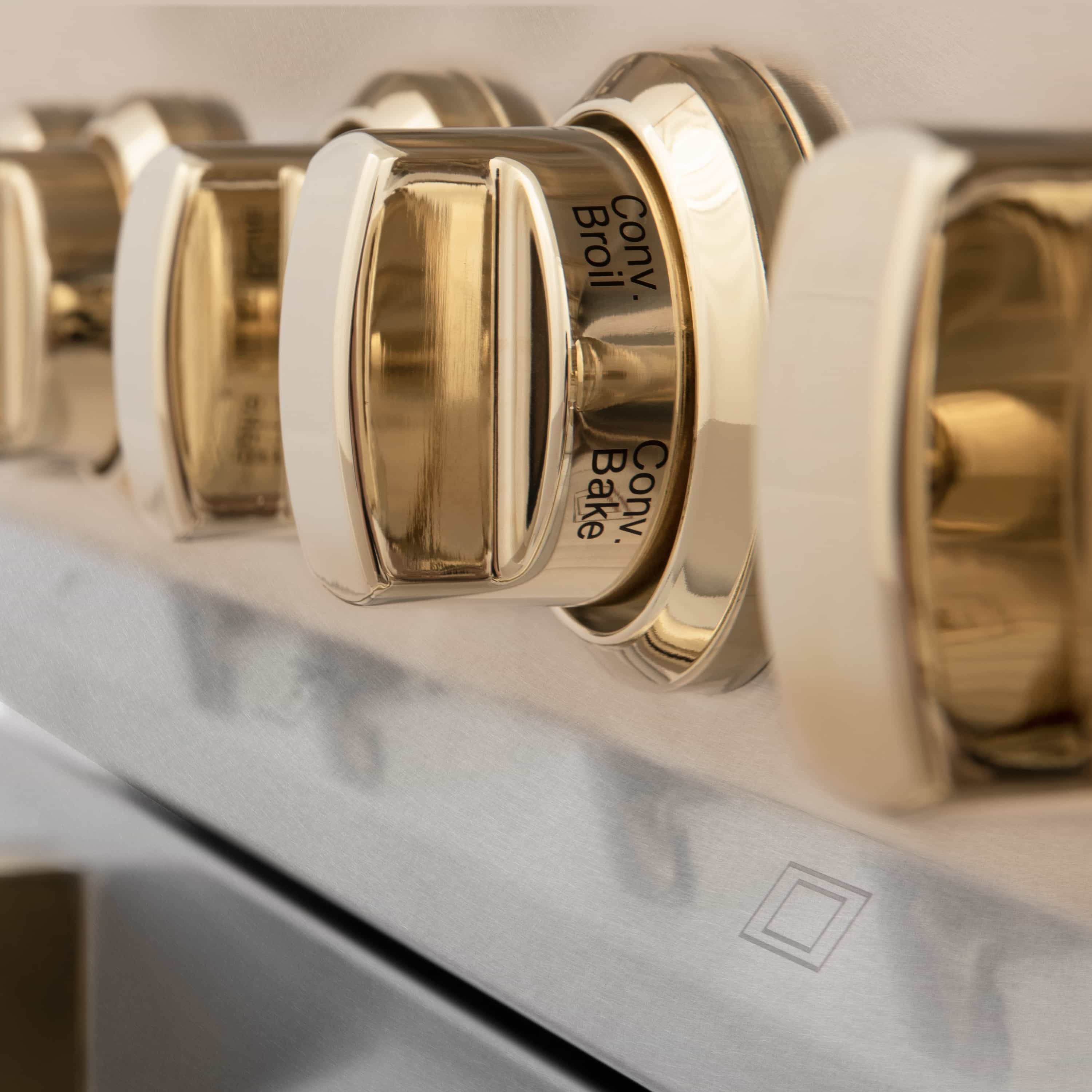 Stainless steel control knob with gold accent for cooktop settings
