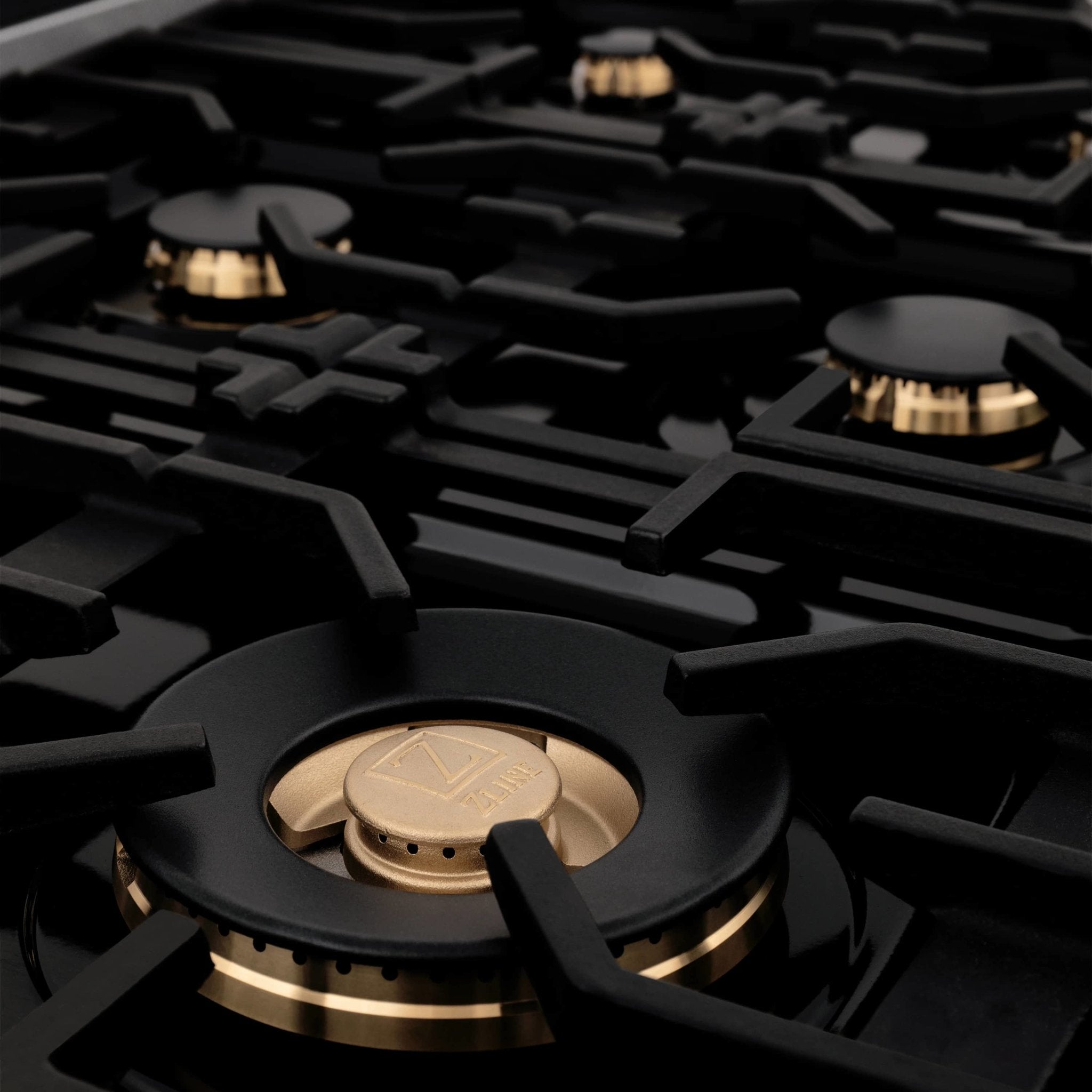 Dual fuel range cooktop with multiple burners and black cast-iron grates