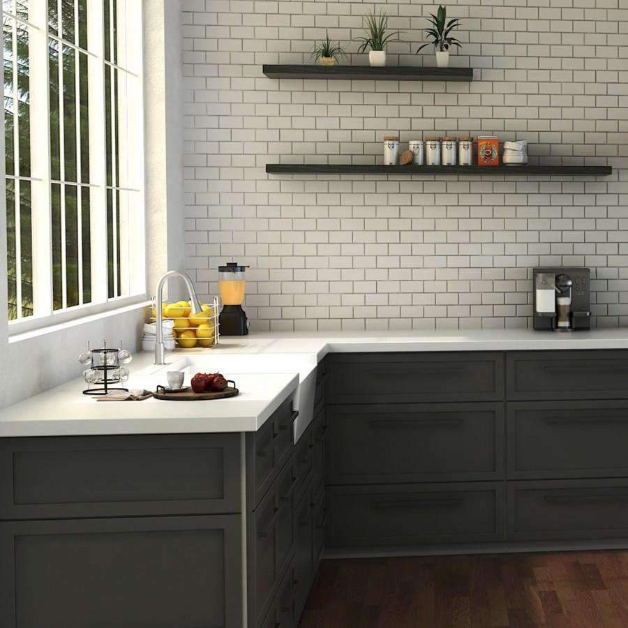 Brushed nickel kitchen faucet over sink with tall arched spout