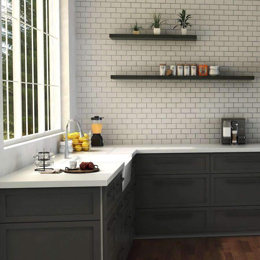 Chrome kitchen faucet with tall curved spout over dark cabinet sink area