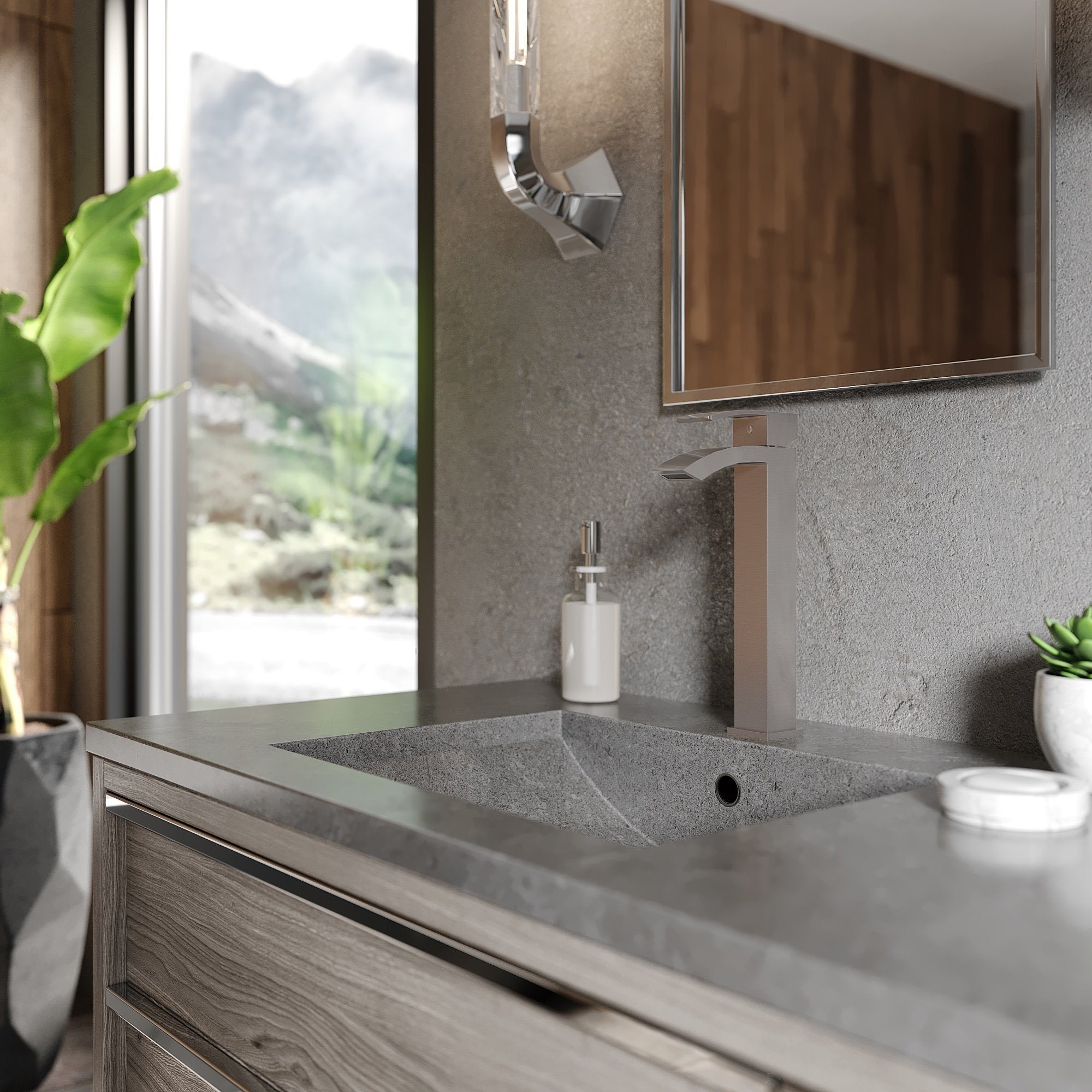 Gun metal deck-mounted bath faucet with curved spout above vanity sink.