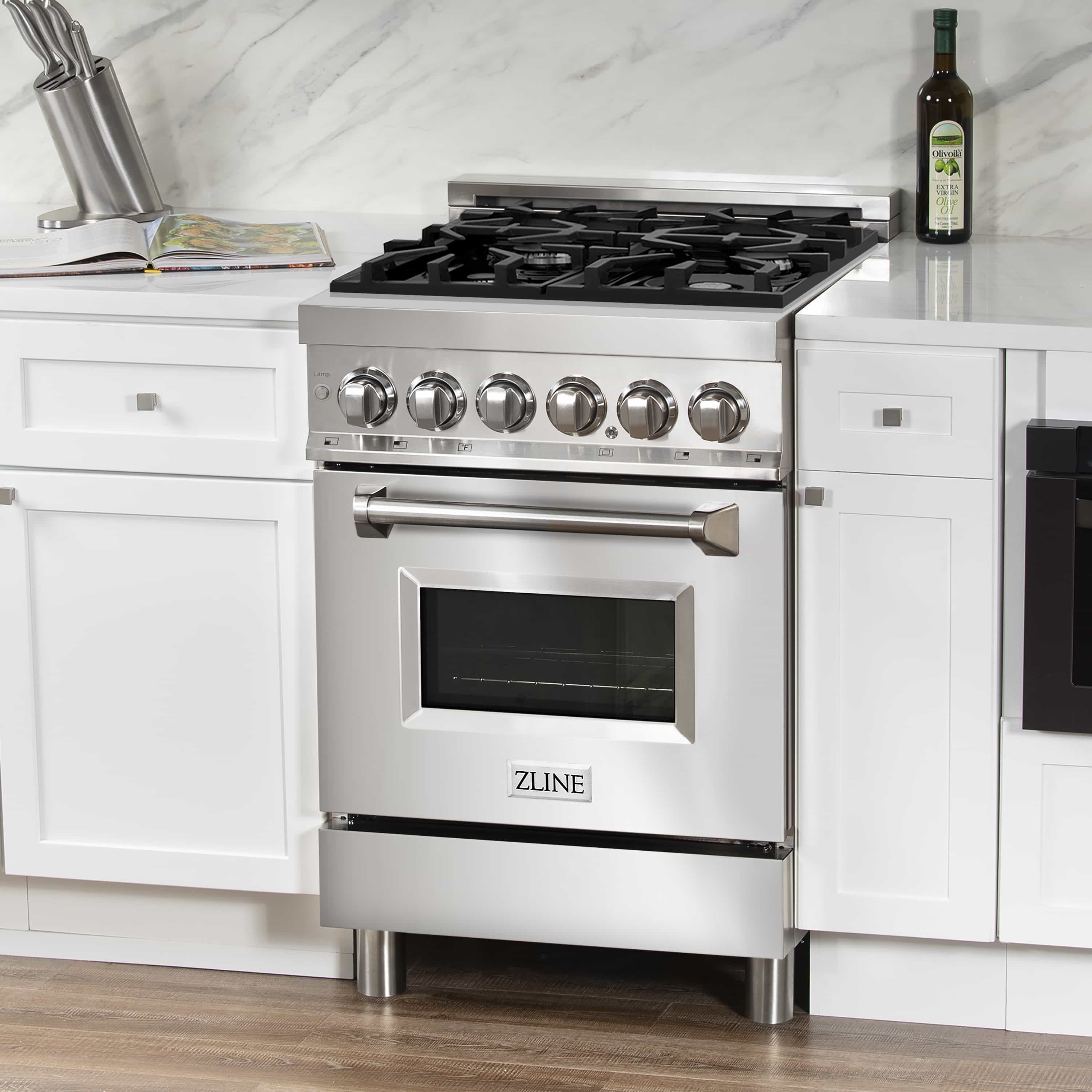 Stainless steel dual fuel range with five black gas burners and control knobs