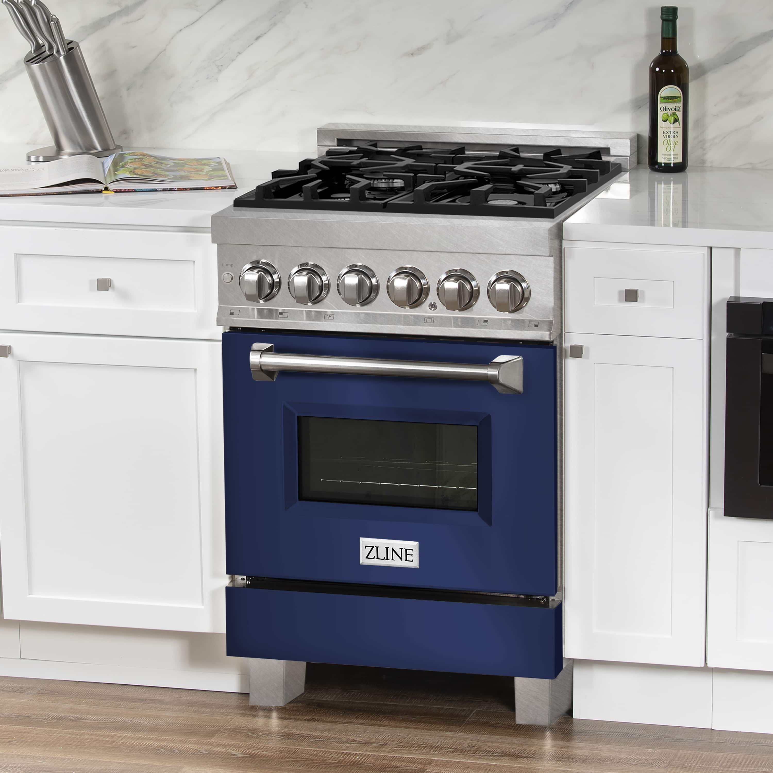 Dual-fuel range front, stainless cooktop with black grates and blue oven door
