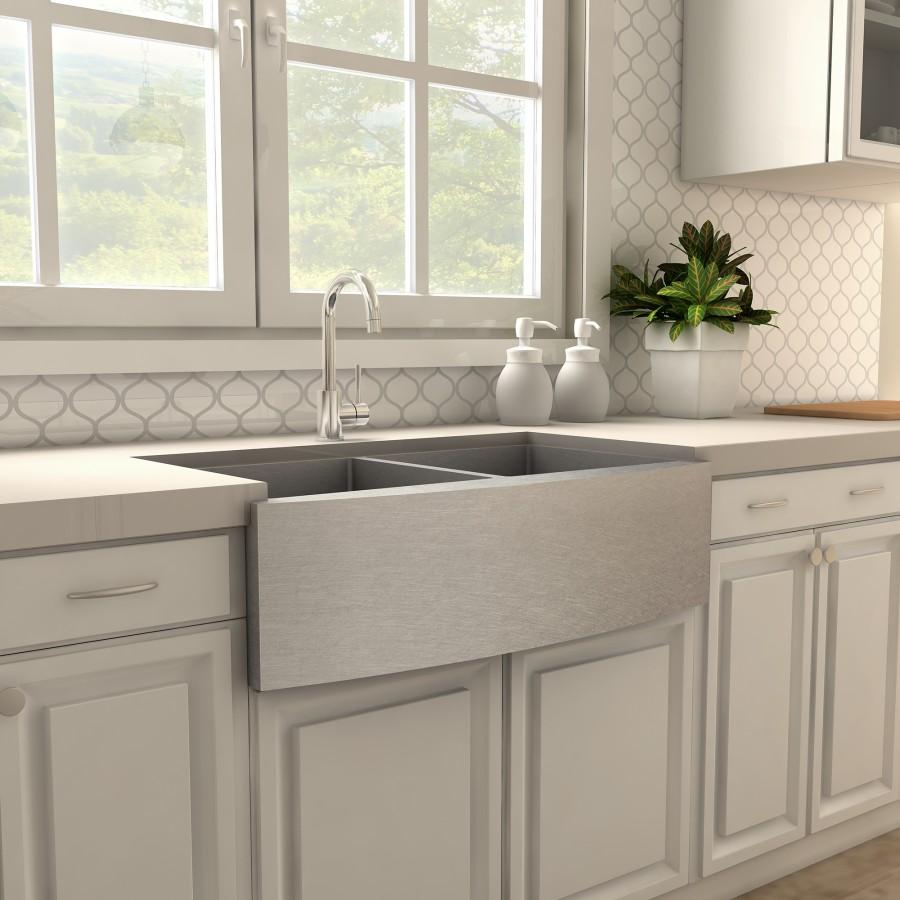Chrome deck-mount kitchen faucet with tall arched spout and single handle.