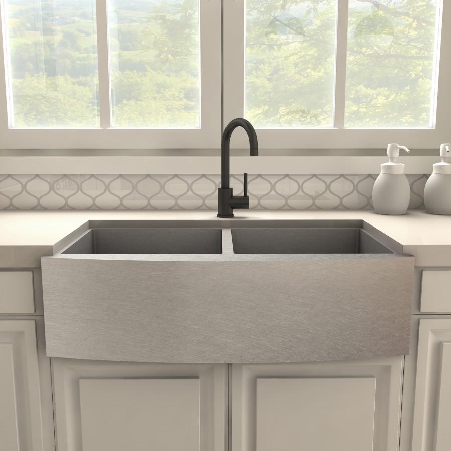 Matte black kitchen faucet with curved spout and side lever on deck