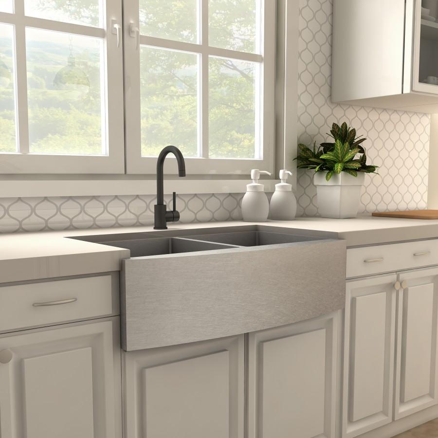 Matte black kitchen faucet over double sink with tall curved spout