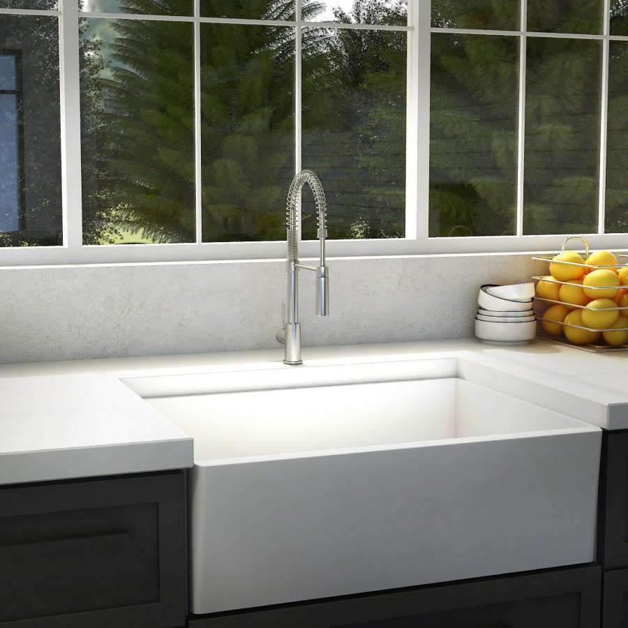 Chrome kitchen faucet with tall gooseneck and braided pull-down sprayer