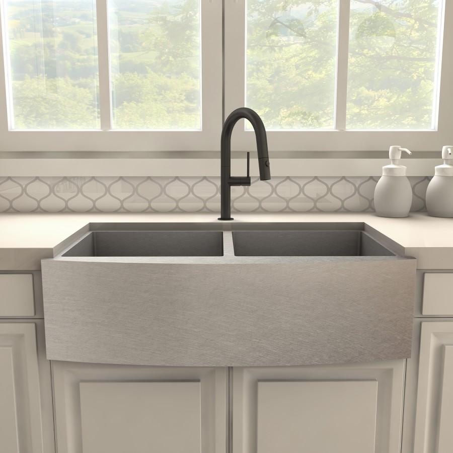 Matte black kitchen faucet over large farmhouse sink